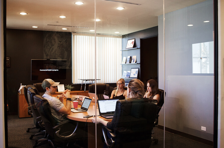 Casual meeting in the conference room.