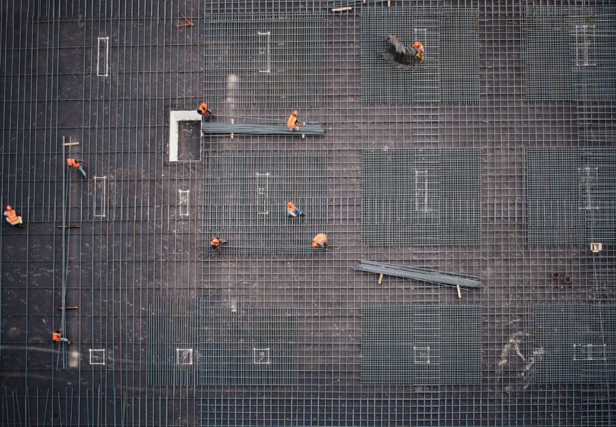 Arial view of construction workers preparing to pour concrete.