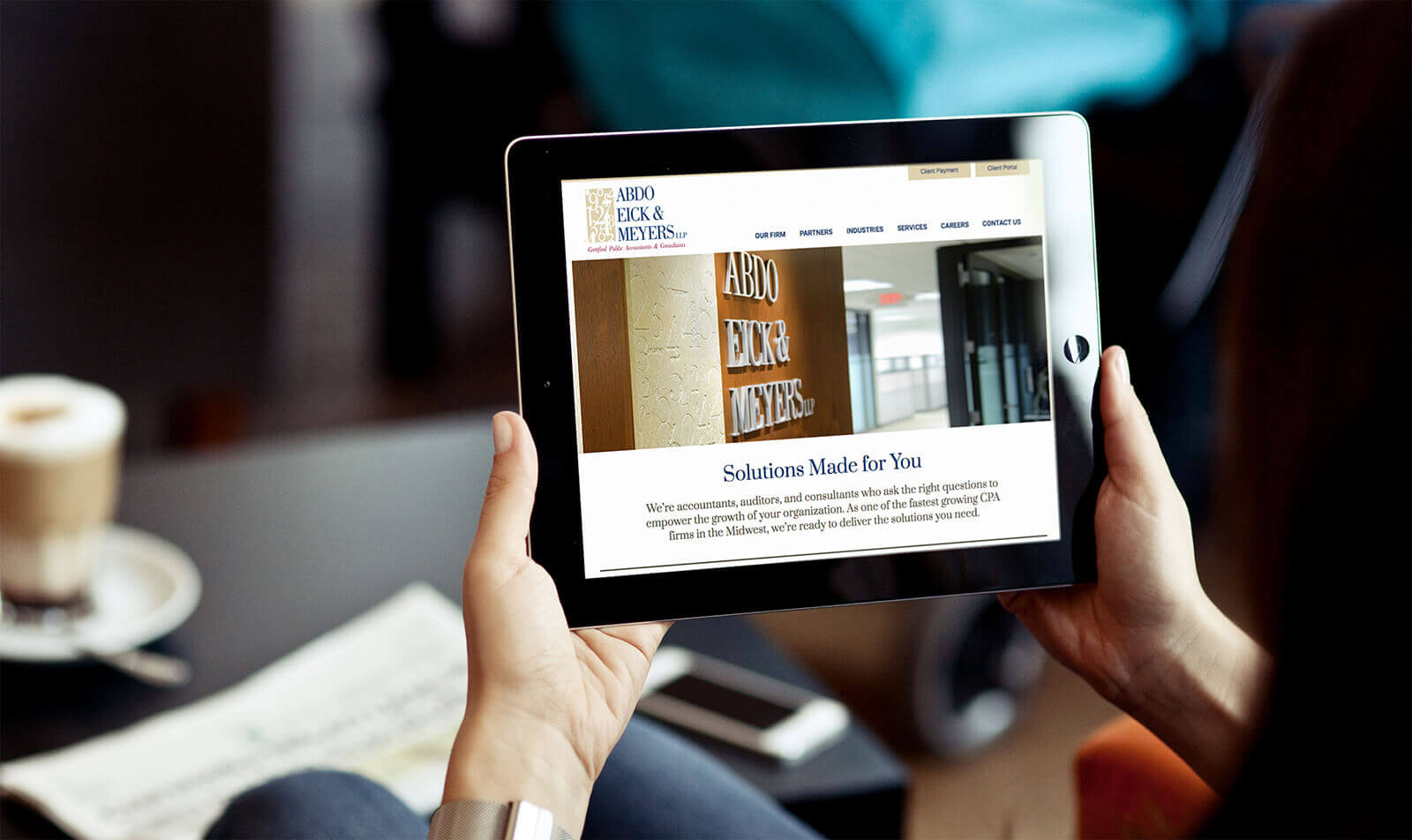 Website for Abdo Eick & Meyers being viewed on a tablet
